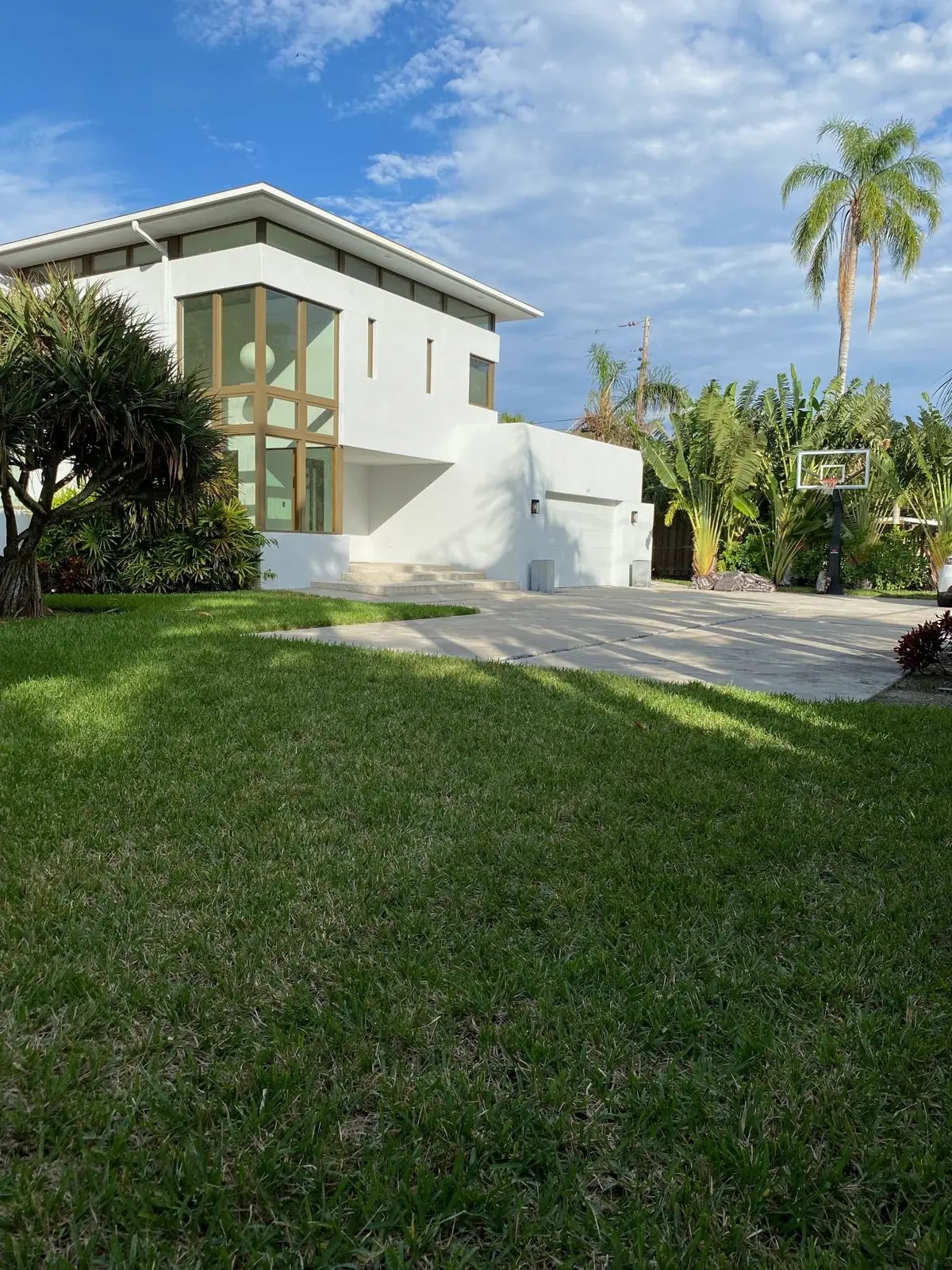 ARM-built white stucco home with bronze-framed windows